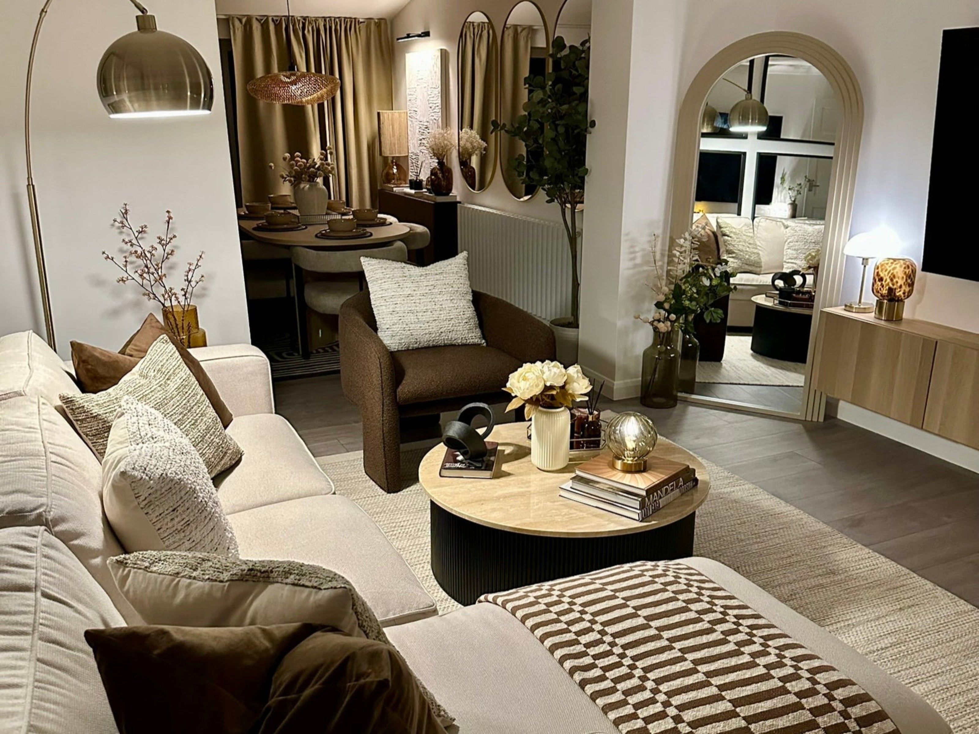 Modern living room with a sofa, coffee table, and decorative items.